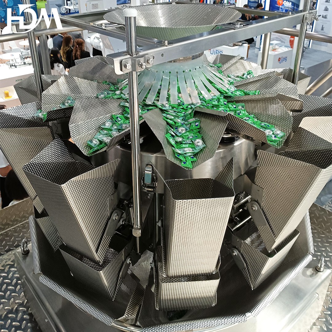 A person receiving a manicure, using a nail brush to clean and shape their nails at a nail salon